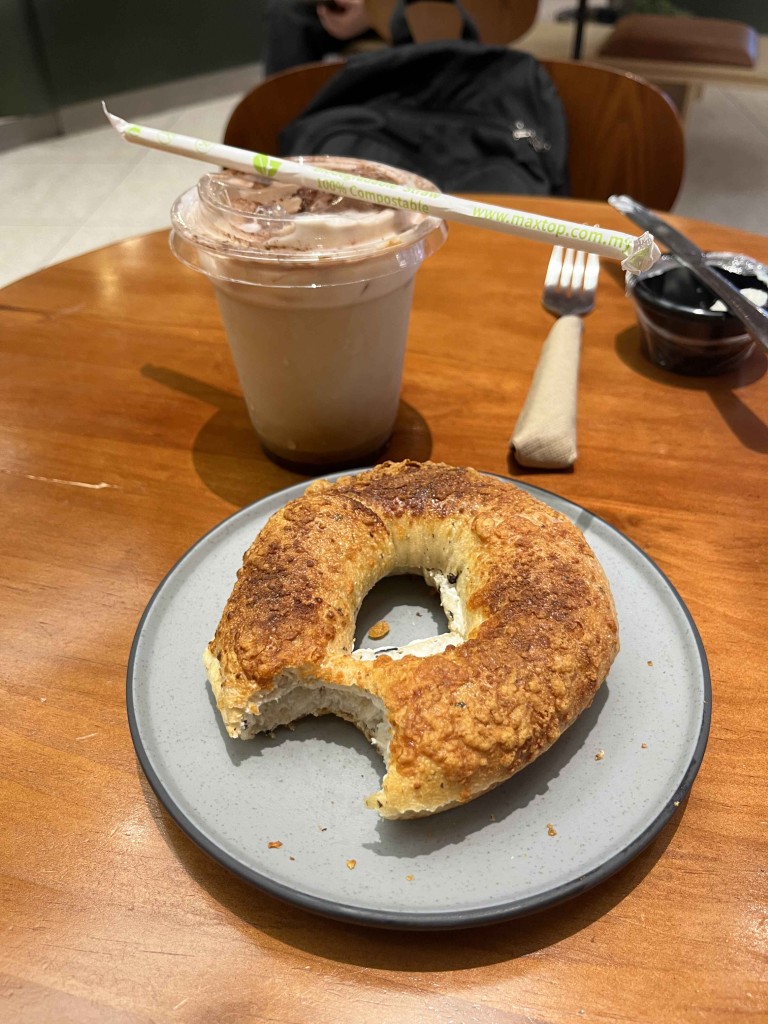 creme cheese bagel and cold coffee